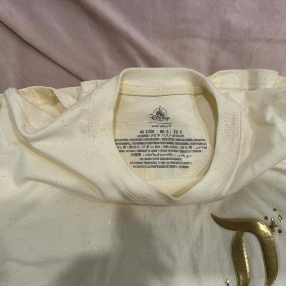 Disneyland Resort Pixie Dust Cream/Gold Spirit Jersey w/ Gold Foil Logo, Small - Picture 2 of 3